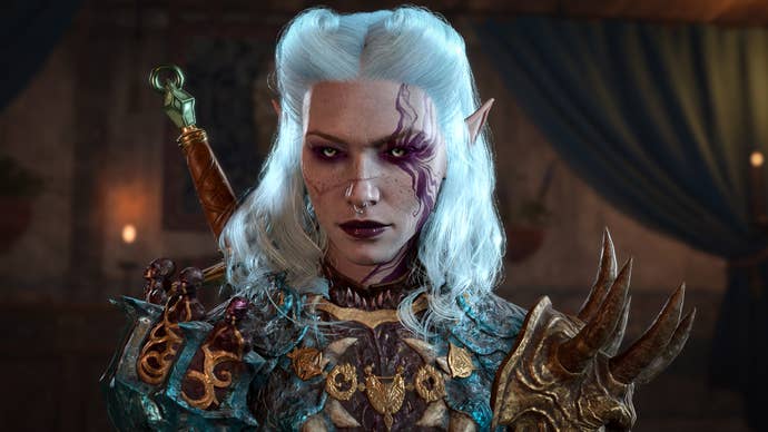 A close-up screenshot of a white-haired and pale-faced elven player character in Baldur's Gate 3. They were ornate plate armour with horned shoulders, and they have dark make-up on their eyes and lips. A swirly purple pattern emerges like smoke from one of their eyes. It's a striking image.